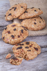 Cakes of healthy cereal with dried fruits on a rustic table