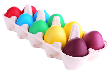 Colorful Easter eggs in tray isolated on white