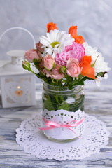 Beautiful bouquet of bright flowers in jar