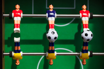 football - board game with players, soccer ball and green field