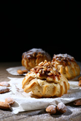 Tasty cakes on table on black background
