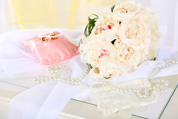 Obraz na płótnie Canvas Beautiful wedding bouquet and decorative pillow for wedding