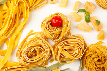 Raw homemade pasta and tomatoes, closeup