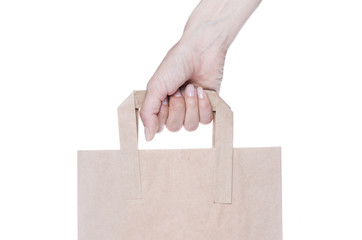 Brown paper shopping bag isolated on white background
