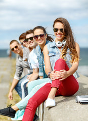 teenage girl hanging out with friends outdoors