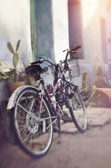 Fotobehang Rustic old bike traditional old home © BCFC