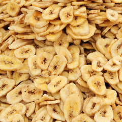 Obraz na płótnie Canvas dried sliced banana fruits as background