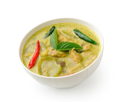 Thai food chicken green curry in the white bolw on white backgro
