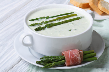 Cream of asparagus soup close-up horizontal