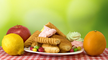 image of of sweets and fruits on white background closeup
