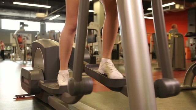 Young girl exercising at the Gym