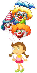 Fototapeta premium A young girl holding three clown balloons