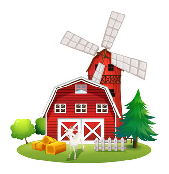 A farm with a red house and a windmill
