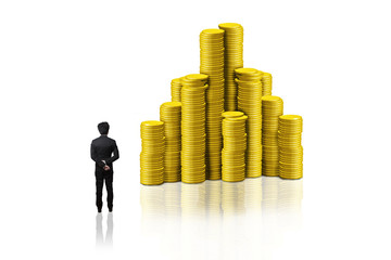 businessman standing stack of golden coins