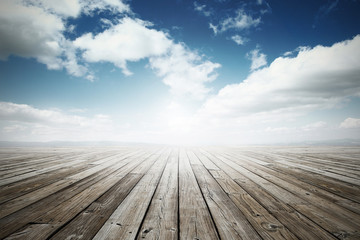 wooden surface under blue sky