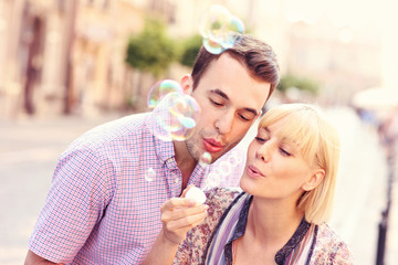 Young couple and bubbles
