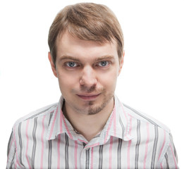 Young man with a beard on half of the face.