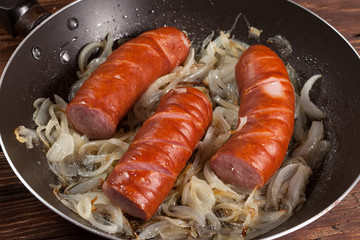 Fried sausage with onions.