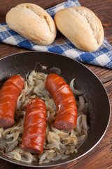 Fried sausage with onions.