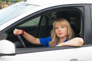Obraz na płótnie Canvas Young woman in car
