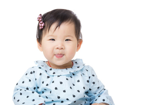 Asia baby girl licking sticking out