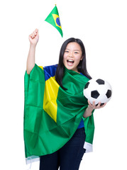 Excited soccer fans holding Brazil flag and football