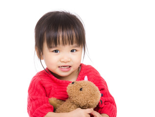 Asian little girl hug with doll