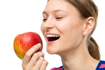 Young happy girl with apple