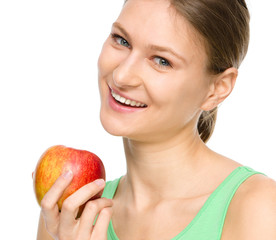 Young happy girl with apple