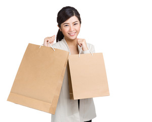 Happy woman holding shopping bag