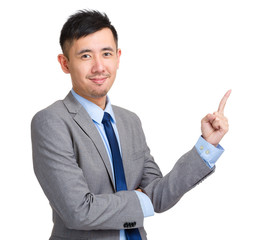 Handsome businessman pointing up with finger