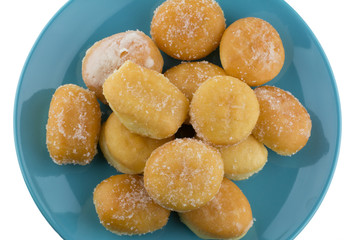 Mini sugary donuts in blue dish