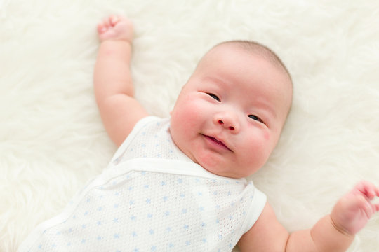 Sweet newborn baby smile