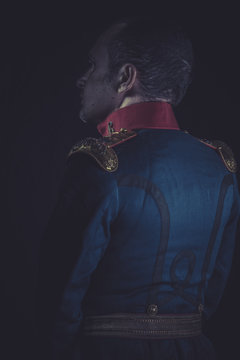 Historical, old soldier style jacket with blue and gold epaulett