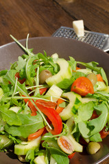 Arugula Salad with tomatoes, olives and parmesan