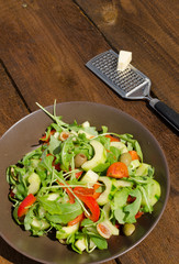 Arugula Salad with tomatoes, olives and parmesan