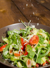 Arugula Salad with tomatoes, olives and parmesan