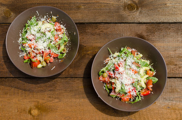 Arugula Salad with tomatoes, olives and parmesan