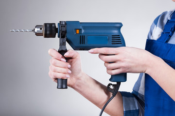 Woman holding a drill