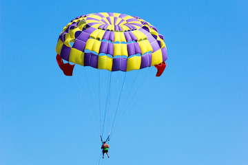 Paraglider in the blue sky