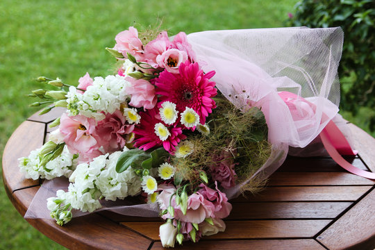 Bouquet of flowers on the wooden table