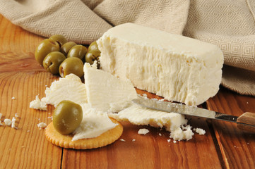 Feta cheese with crackers and olives