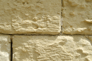 Weathered old sandstone wall background