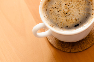 Beverage. Cup of hot drink coffee with froth.