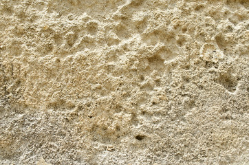 Weathered old sandstone wall background