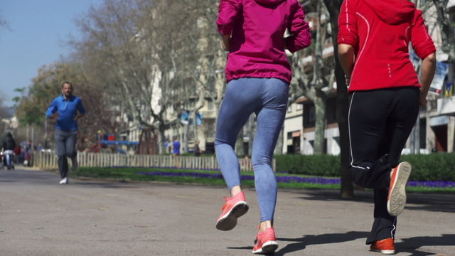 People jogging in the city, slow motion shot at 120fps, steadyca