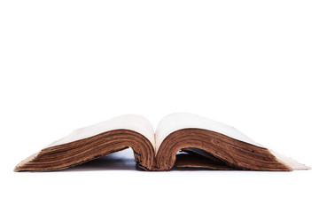opened old book on white background