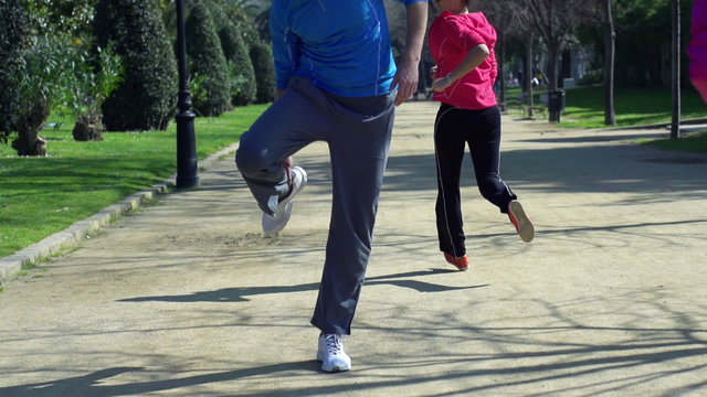 Jogger having muscle contraction, slow motion shot at 240fps, st