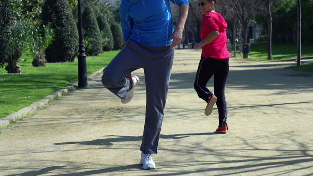 Jogger having muscle contraction, slow motion shot at 60fps, ste