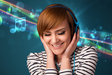 Young woman listening to music with headphones